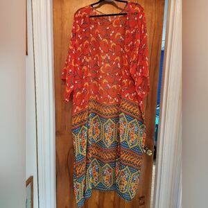 Vibrant bohemian sheer cover-up with vibrant paisley design. OS